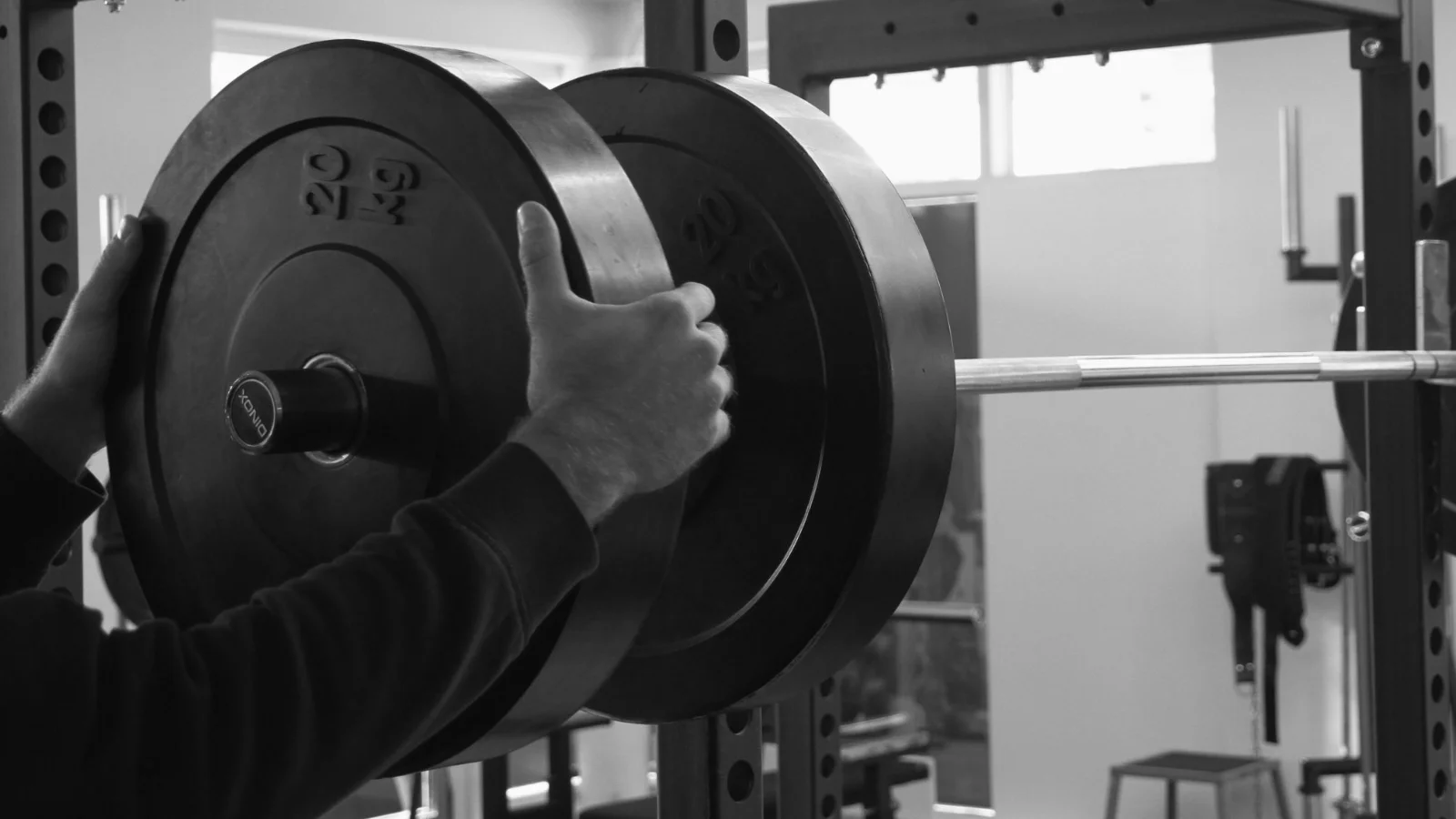 Progressive overload - a lifter training with a barbell